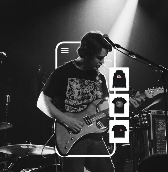 Band member playing the guitar and wearing custom band merch created with Triplacement and printed on demand. 